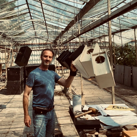 Marcel at the neighbour’s greenhouse. Marcel at the neighbour’s greenhouse